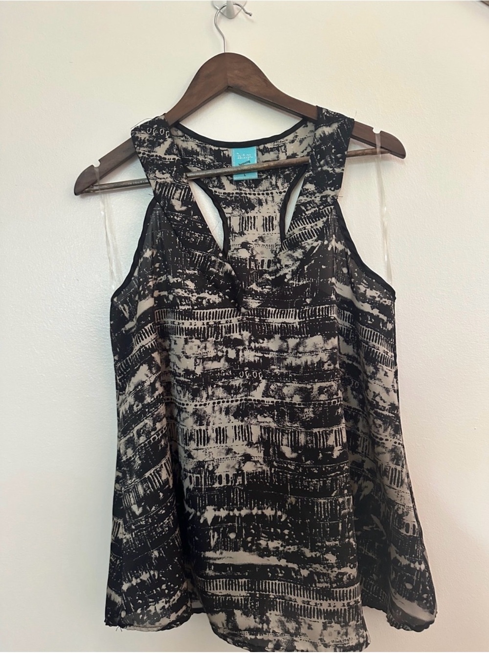 happening in the present Black & Cream Abstract Racerback Camisole